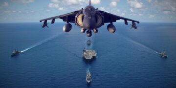 Fighter jet over aircraft carrier