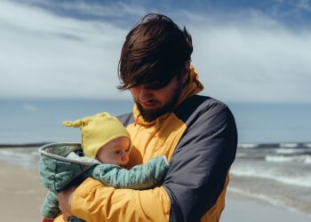 Father with a child on a seashore