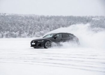 Car on fronzen bay. Illustrative.