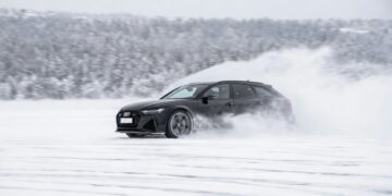 Car on fronzen bay. Illustrative.